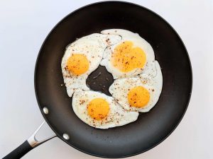 fried egg in pan with paprika