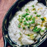 Garlic Mashed Cauliflower in dish on wooden table