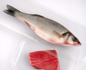 whole fish and fillet of salmon in a vacuum sealed package