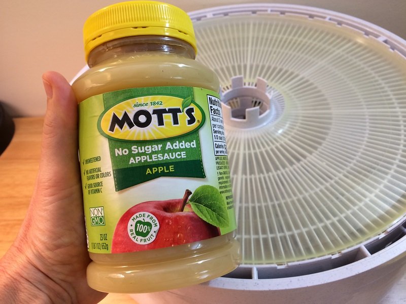 Motts applesauce next to dehydrator and tray